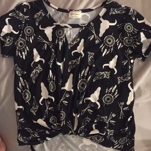 I am selling a black and white steerhead blouse.